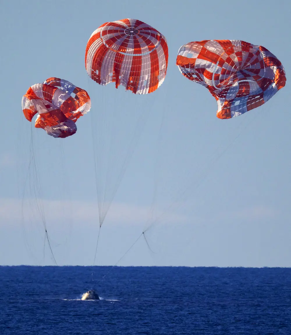 May 2026 - Artemis comes back from around the moon and touchdown under conventional parachutes.