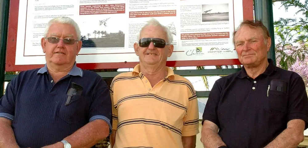 Left to right. Rod Fuller,Pat Crowe and John Dickenson in Grafton,Australia,in front of a memorial to their feats,on the 50th anniversary of their first flights.